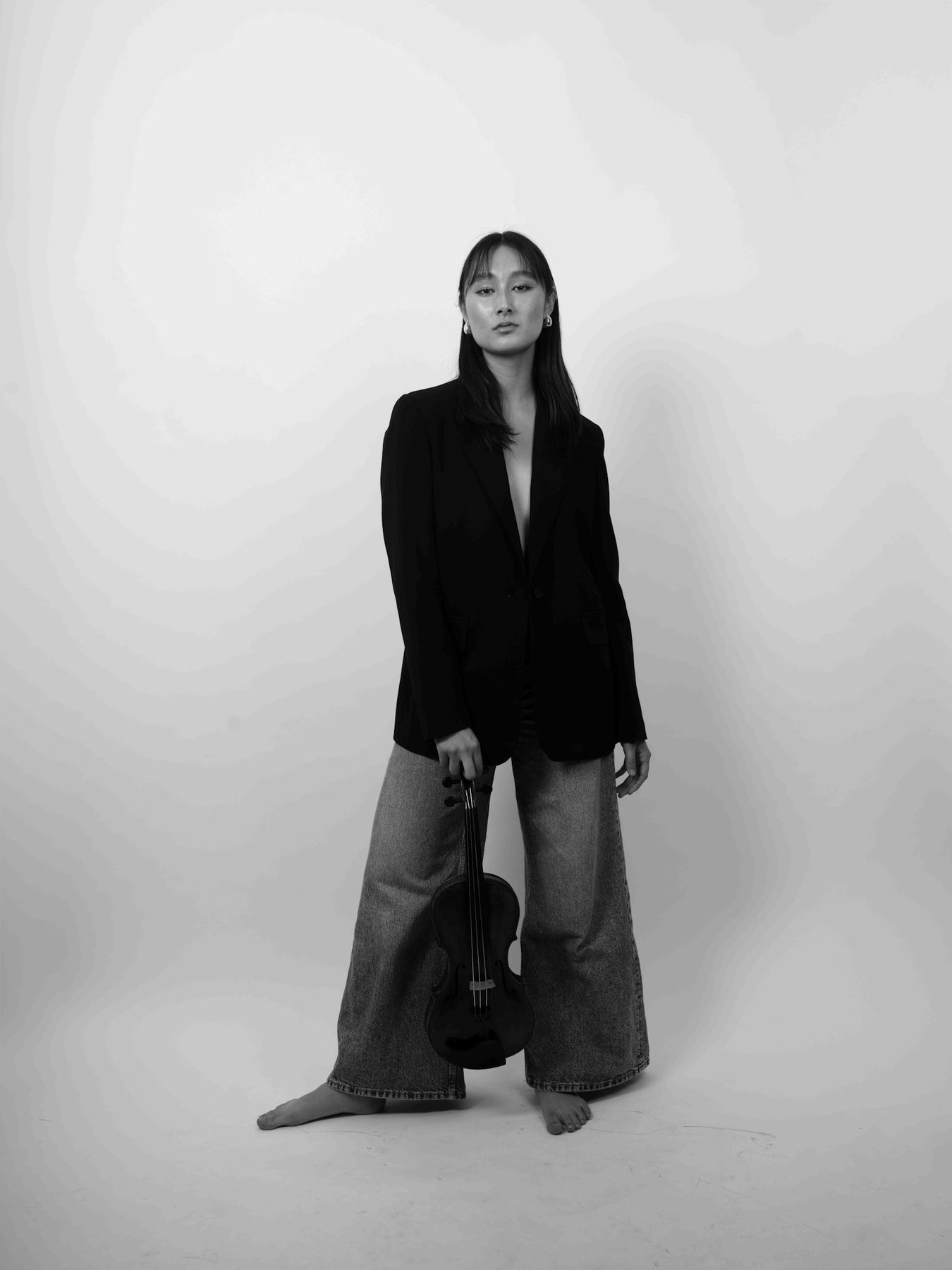 Maya Kilburn standing, black-and-white editorial portrait
