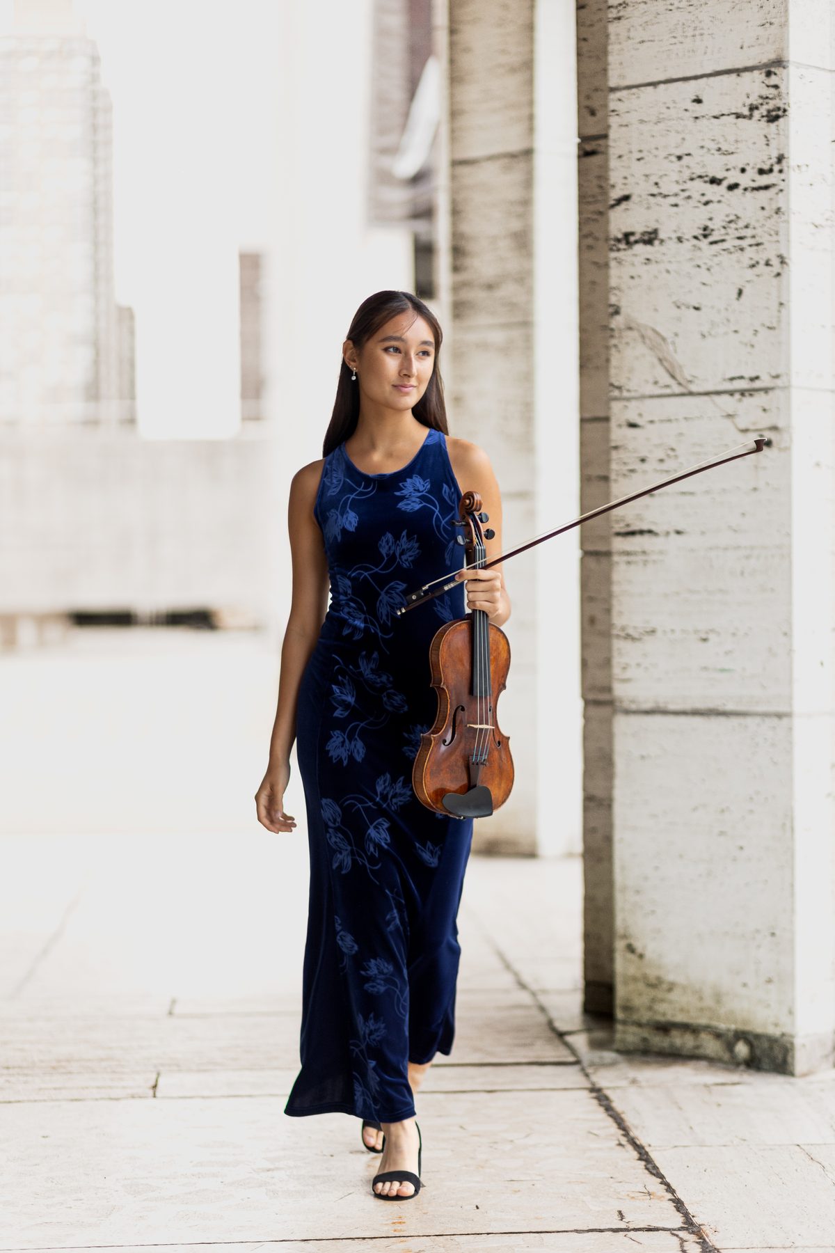 Maya Kilburn in a blue dress, full-length portrait